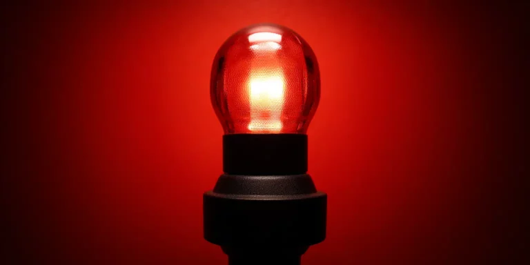 light bulb in red background
